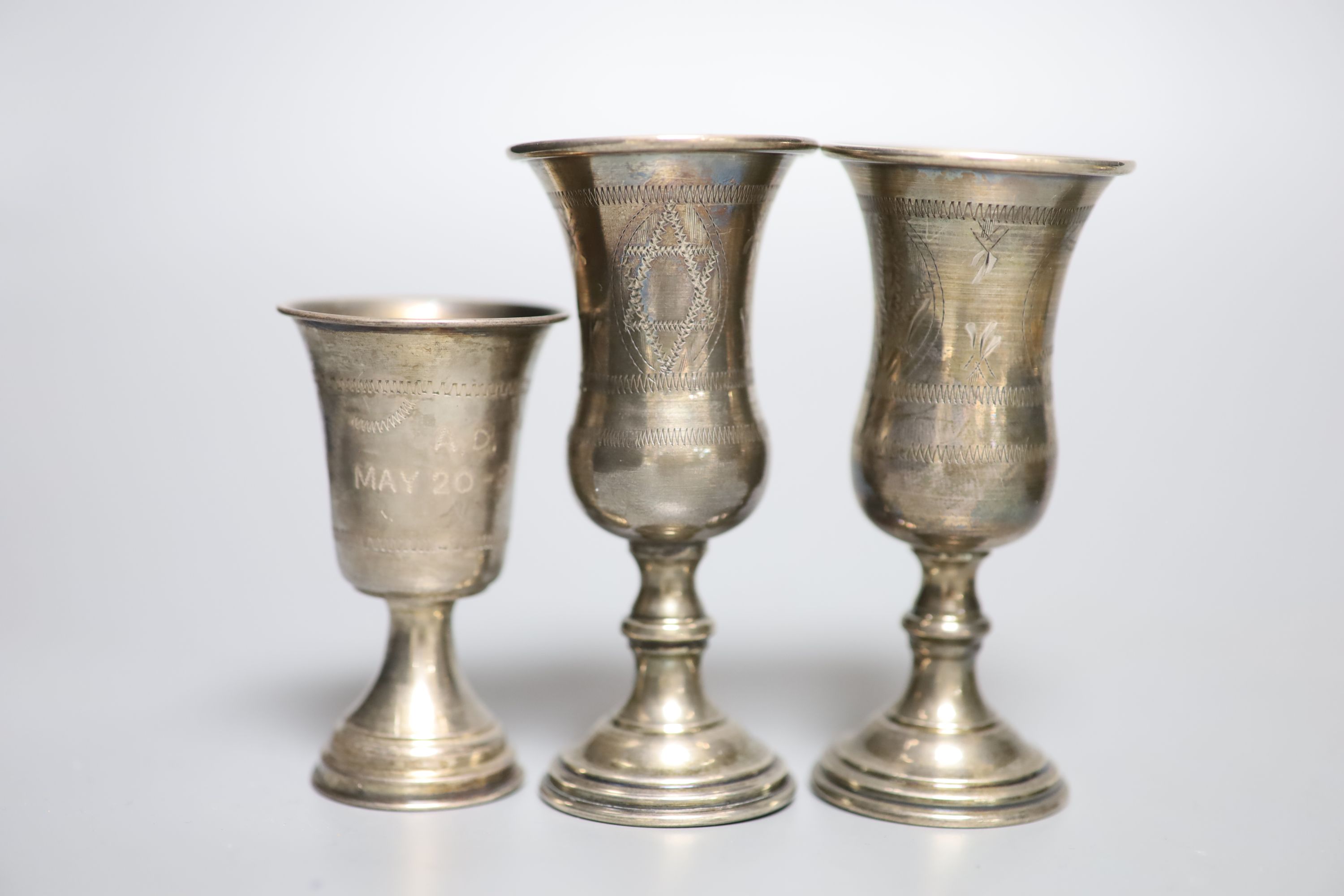 A cased set of six late 19th century Russian 84 zolotnik and niello teaspoons, three sterling kiddush cups, a French white metal napkin ring, a small sterling napkin ring and an Indian white metal bowl.